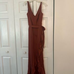 David’s bridal size 4. I am 5’10 and this dress is perfectly long enough w/heals